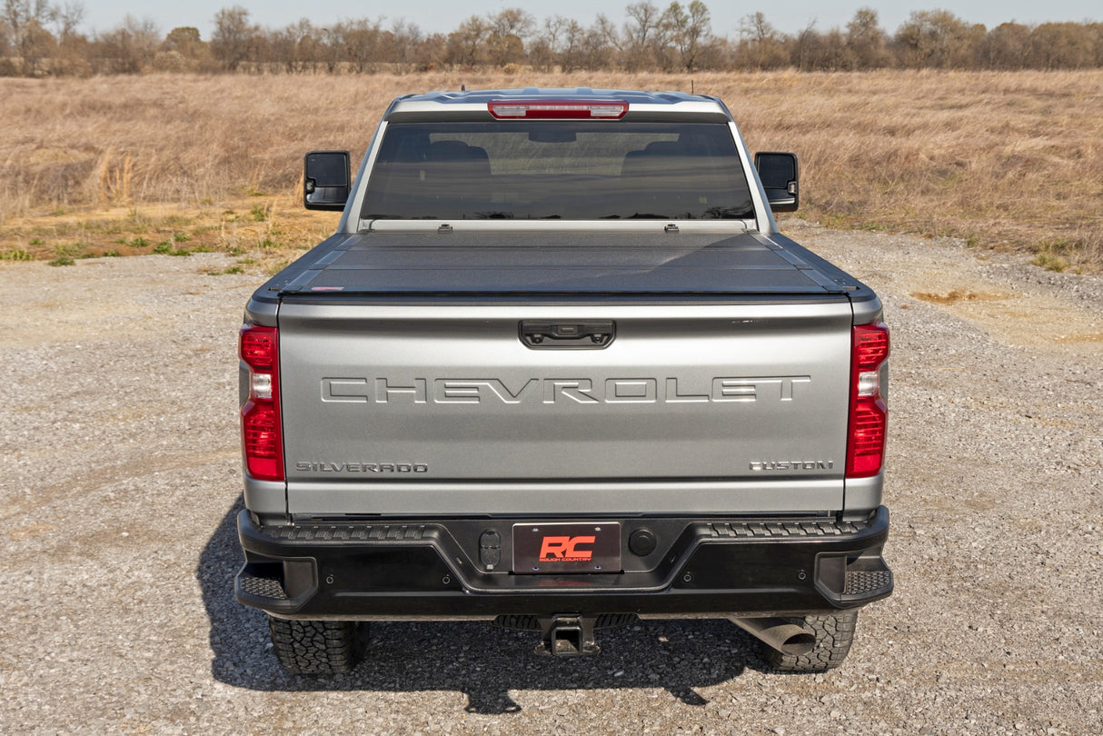 Hard Tri-Fold Flip Up Bed Cover | 6'9" Bed | Chevy/GMC Silverado/Sierra 2500HD/3500HD (20-24)