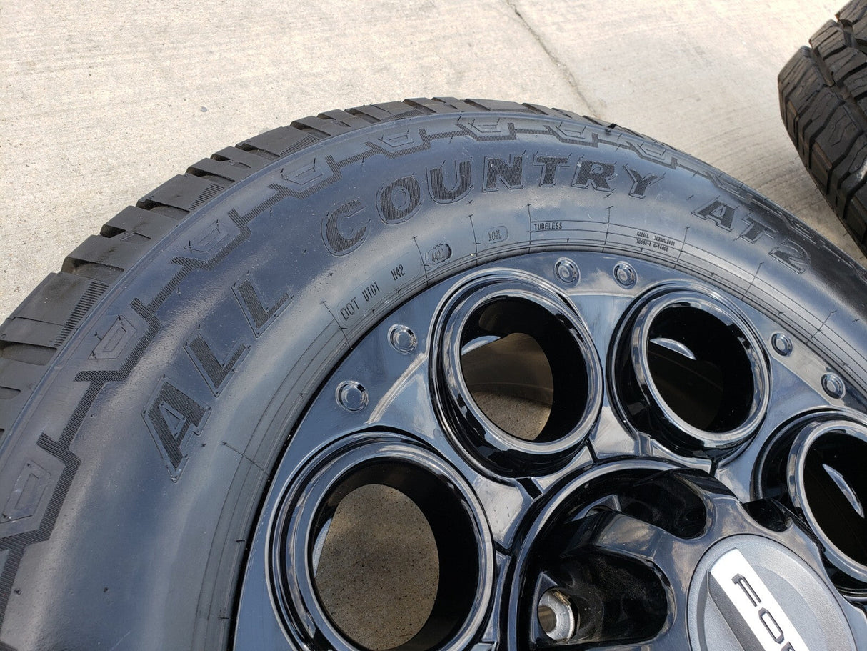 20" Ford F-250 F-350 OEM black TREMOR wheels rims 10299 10484 A/T2 tires NEW Texas Truck Tire