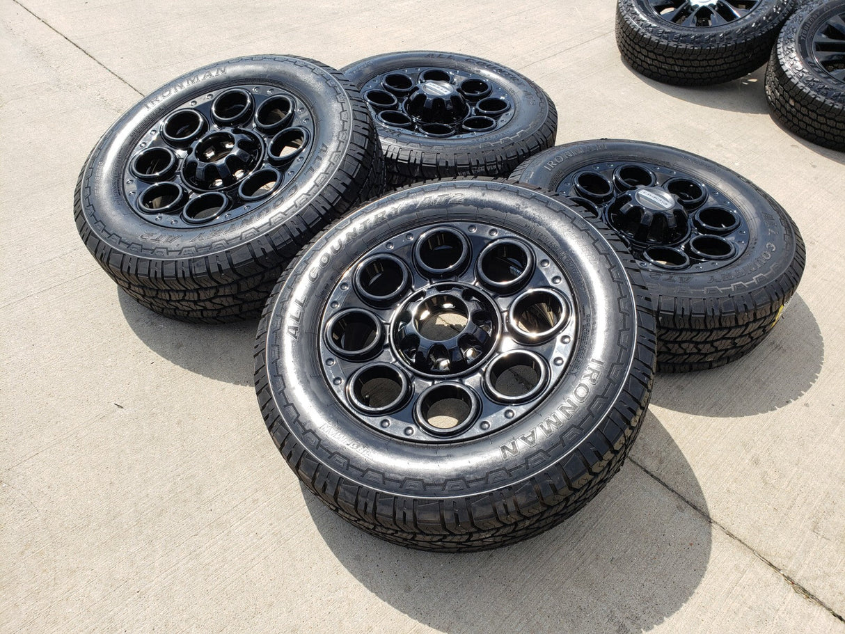 20" Ford F-250 F-350 OEM black TREMOR wheels rims 10299 10484 A/T2 tires NEW Texas Truck Tire