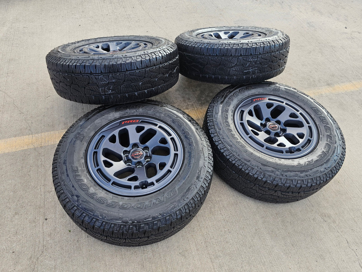 17" Nissan Frontier X-PRO OEM Desert Runner wheels rims tires DUELER A/T Texas Truck Tire