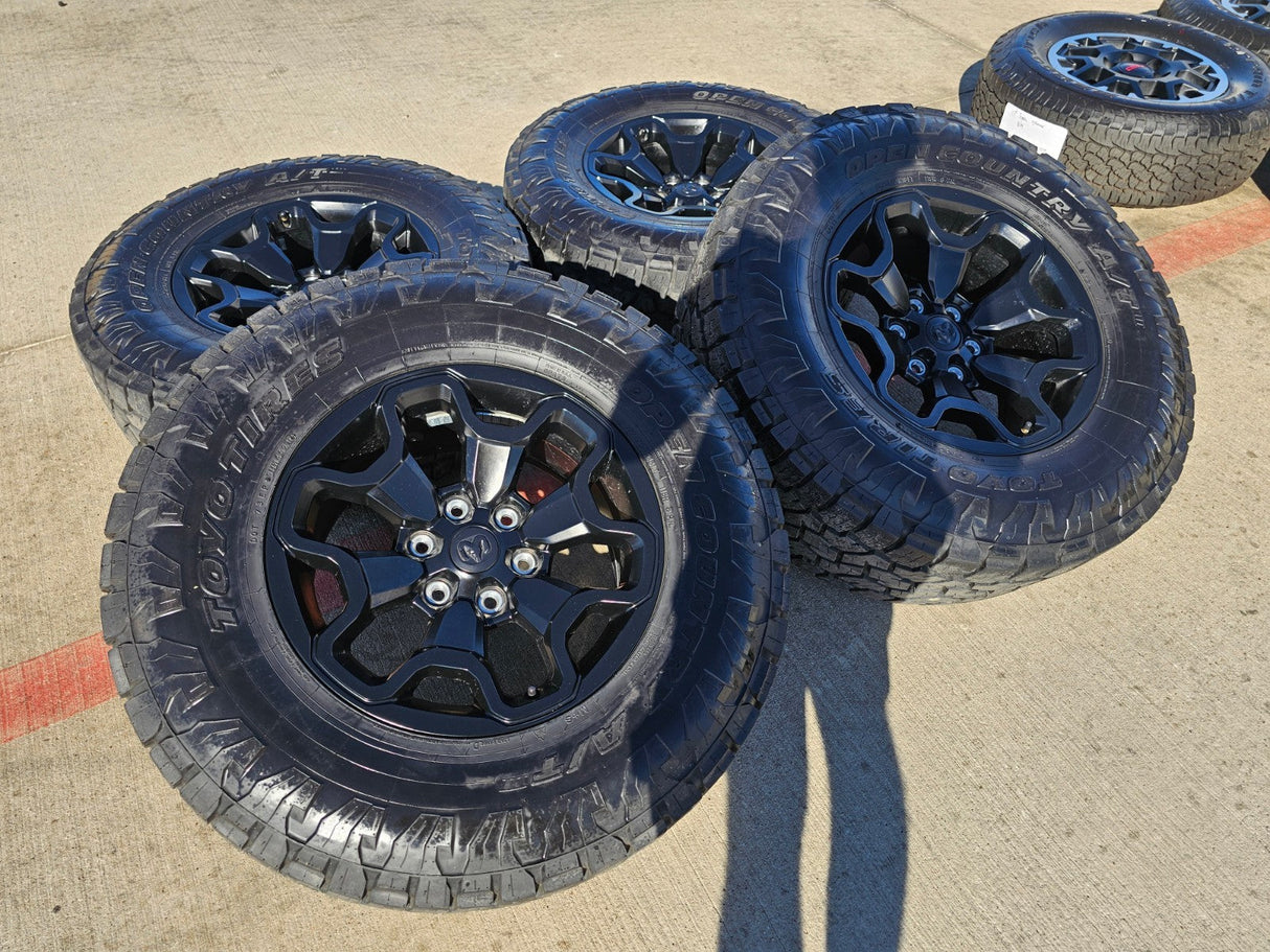 18" Dodge Ram 1500 TRX RHO Black OEM 66002 wheels rims TOYO A/T3 35" Texas Truck Tire