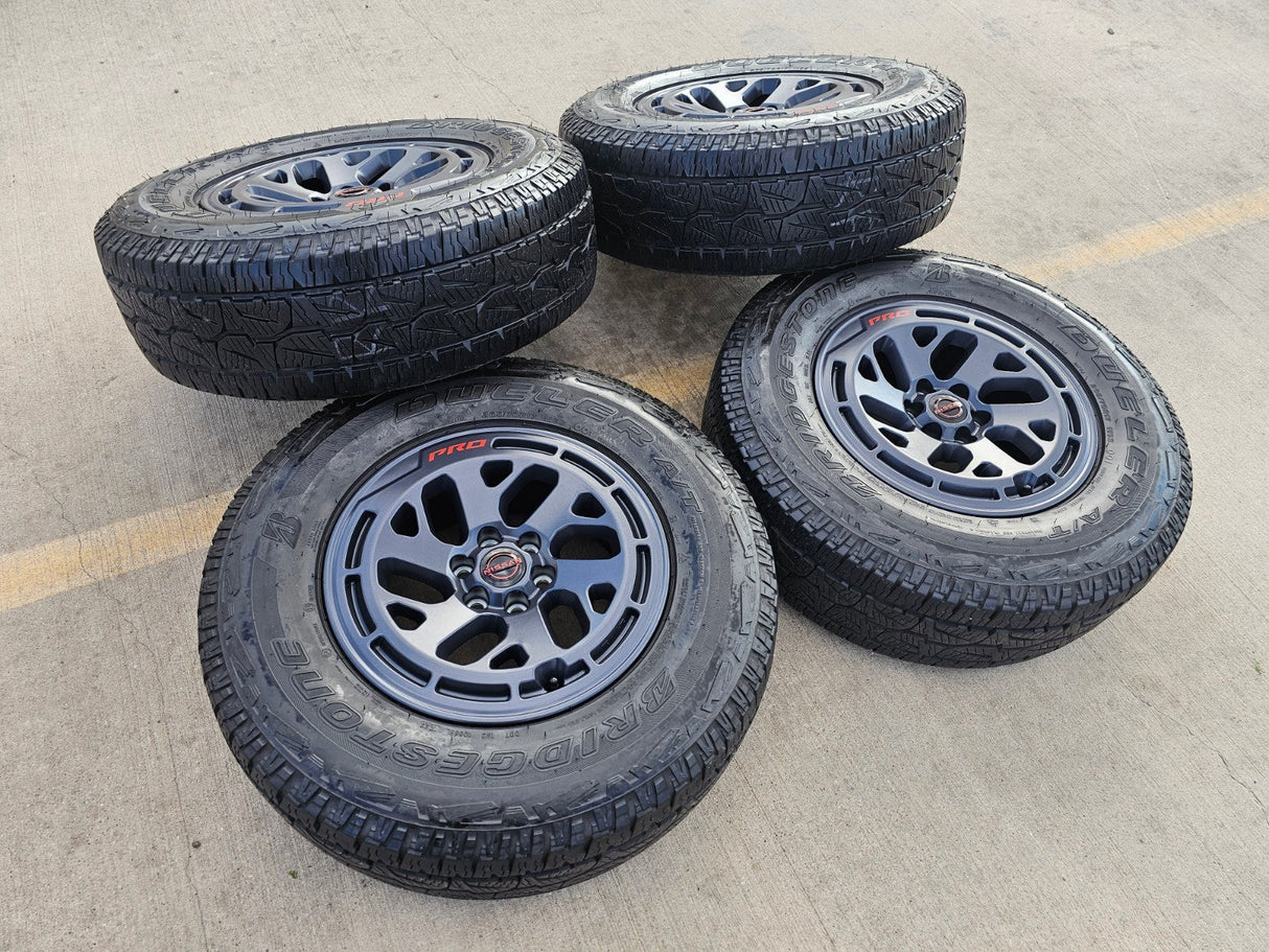 17" Nissan Frontier X-PRO OEM Desert Runner wheels rims tires DUELER A/T Texas Truck Tire