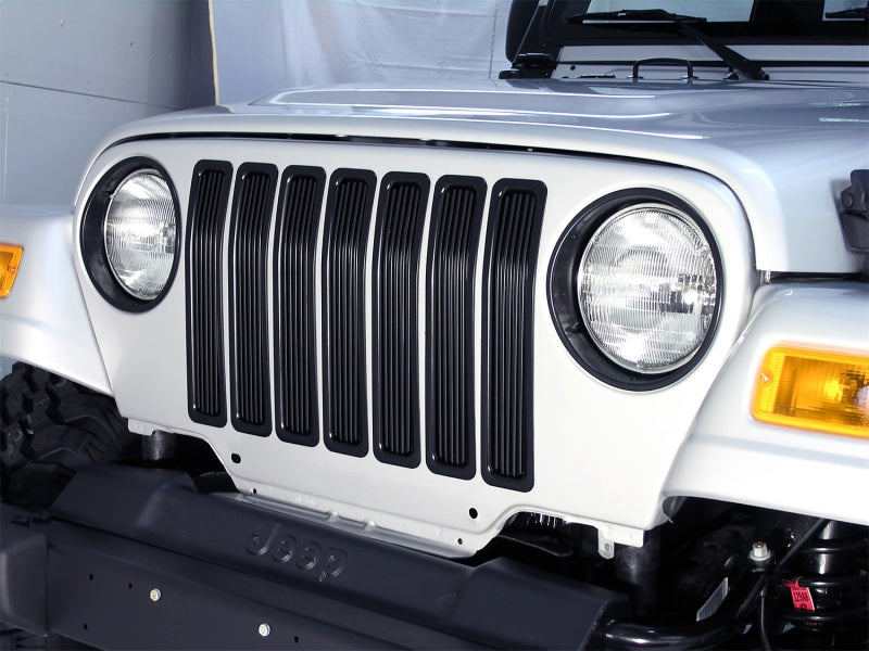 Inserts de calandre en billettes Rugged Ridge noirs pour Jeep Wrangler 97-06