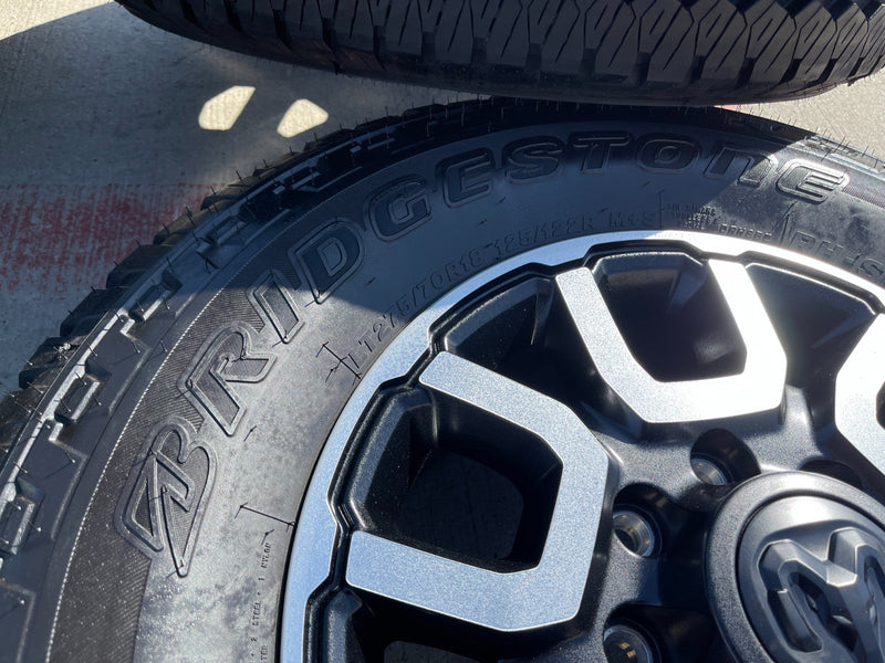 18" Ram 2500 3500 LARAMIE OEM wheels rims 2694 tires BRIDGESTONE A/T NEW 2026 Texas Truck Tire