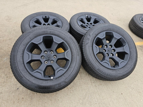 20" Dodge Ram 1500 OEM Laramie Black 2680 wheels rims 2024 2025 2026 BRIDGESTONE Texas Truck Tire