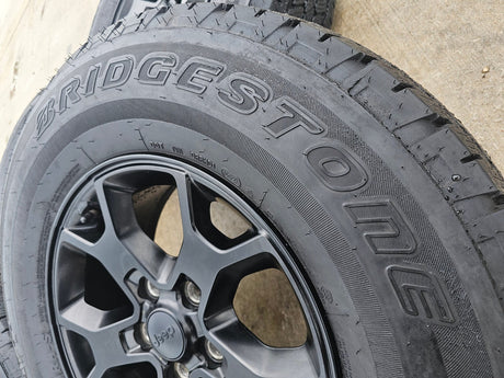17" Jeep Wrangler Rubicon OEM 9218 wheels rims Gladiator tires DUELER A/T Texas Truck Tire