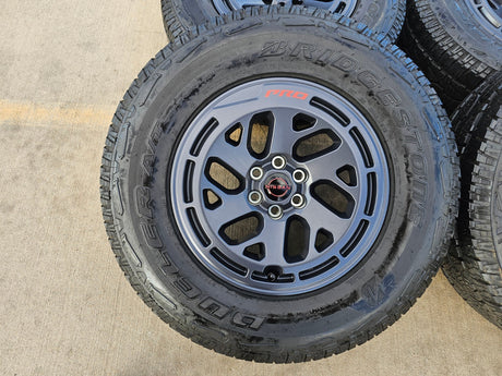 17" Nissan Frontier X-PRO OEM Desert Runner wheels rims tires DUELER A/T Texas Truck Tire