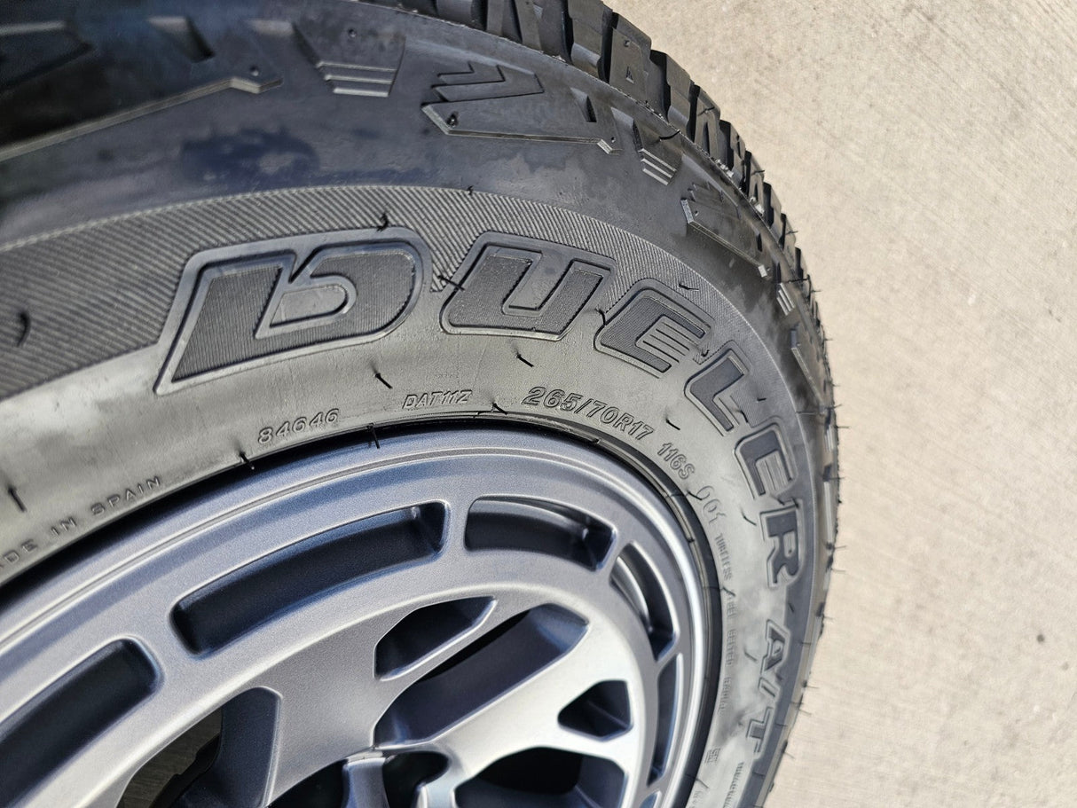 17" Nissan Frontier X-PRO OEM Desert Runner wheels rims tires DUELER A/T Texas Truck Tire