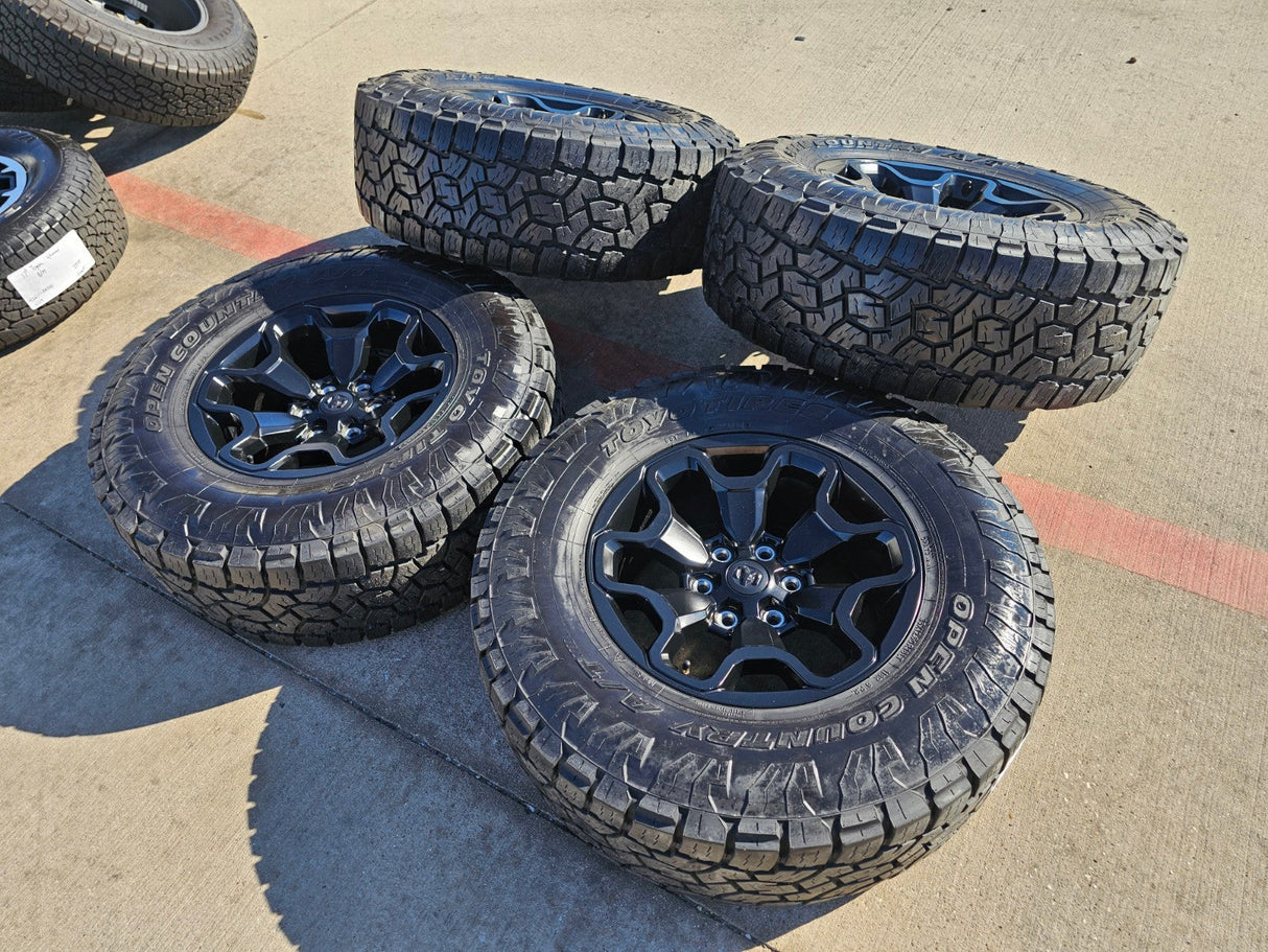 18" Dodge Ram 1500 TRX RHO Black OEM 66002 wheels rims TOYO A/T3 35" Texas Truck Tire