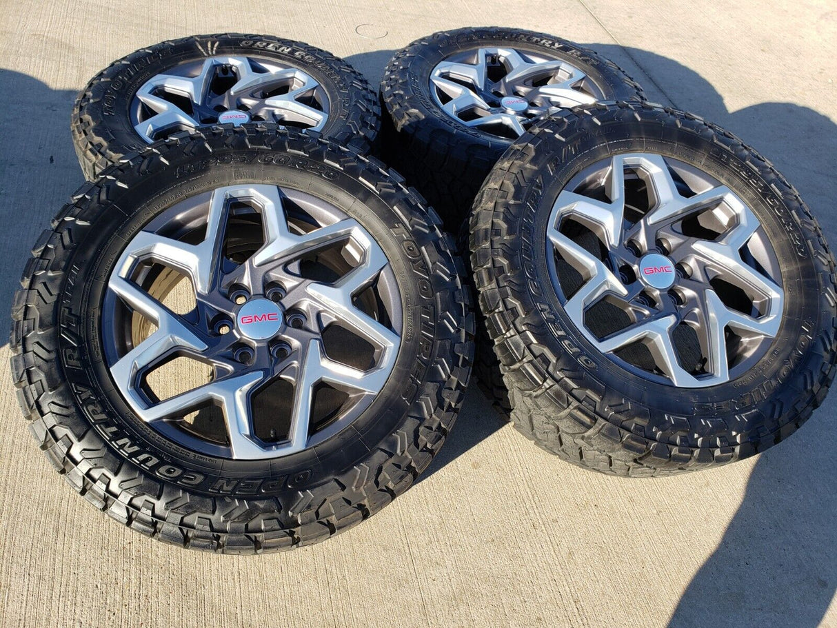 20" GMC Sierra Yukon AT4 Tahoe Silverado OEM 95369 wheels rims TOYO 34" Texas Truck Tire