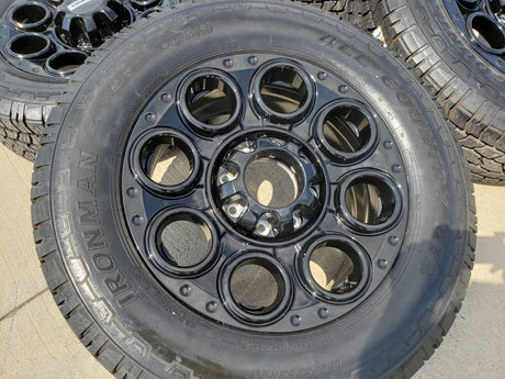 20" Ford F-250 F-350 OEM black TREMOR wheels rims 10299 10484 A/T2 tires NEW Texas Truck Tire