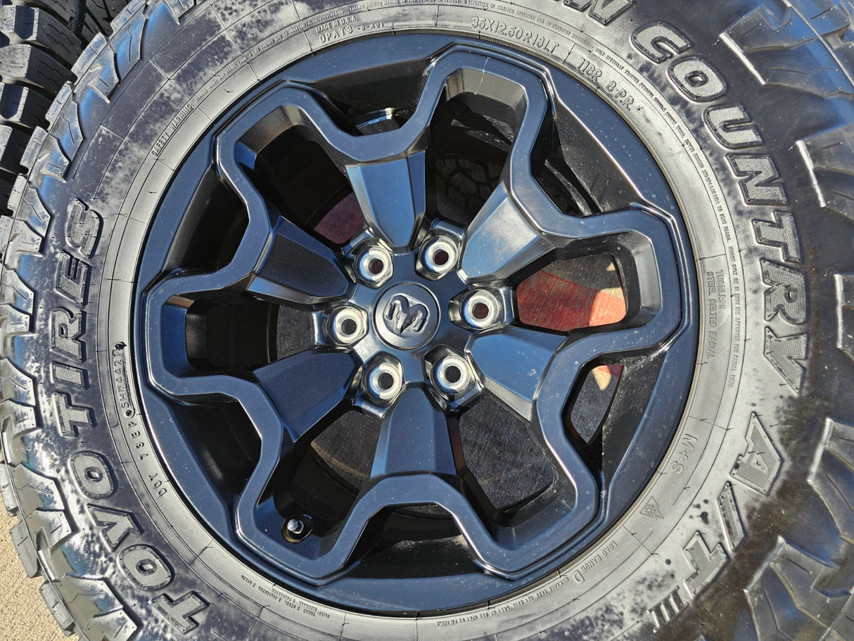 18" Dodge Ram 1500 TRX RHO Black OEM 66002 wheels rims TOYO A/T3 35" Texas Truck Tire