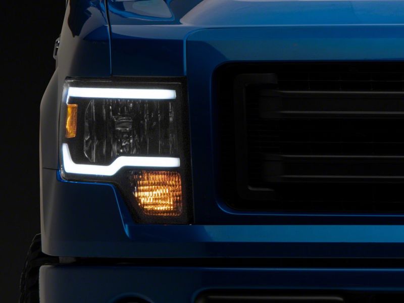 Phares Raxiom 09-14 Ford F-150 série axiale avec barre LED - boîtier noir (lentille transparente)