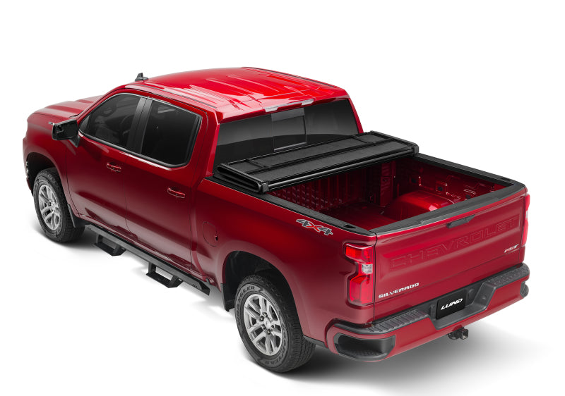 Lund 05-15 Toyota Tacoma Fleetside (5ft. Bed) Hard Fold Tonneau Cover - Black