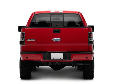 Feux arrière de style européen Raxiom 04-08 Ford F-150 Styleside - Boîtier noir - Lentille rouge/transparente