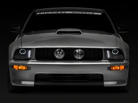 Phares de projecteur à LED Raxiom 05-09 Ford Mustang à l'exclusion de la GT500 - Boîtier noir (lentille transparente)