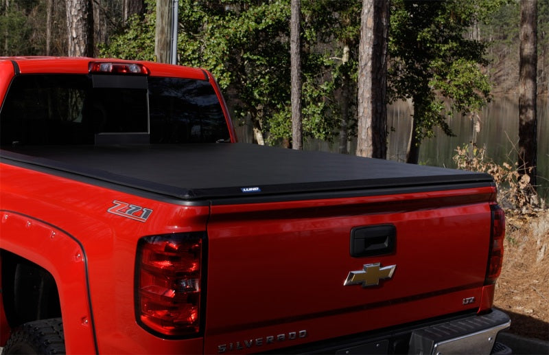 Lund 05-15 Toyota Tacoma Fleetside (6ft. Bed) Hard Fold Tonneau Cover - Black