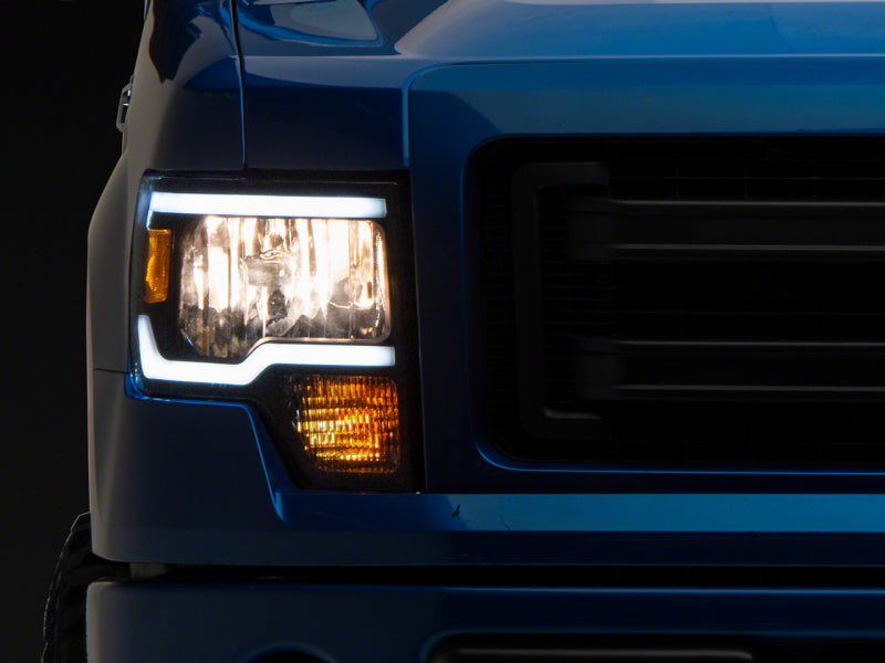 Phares Raxiom 09-14 Ford F-150 série axiale avec barre LED - boîtier noir (lentille transparente)