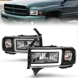 Phare ANZO 94-02 Dodge RAM Crystal - avec barre lumineuse et boîtier noir