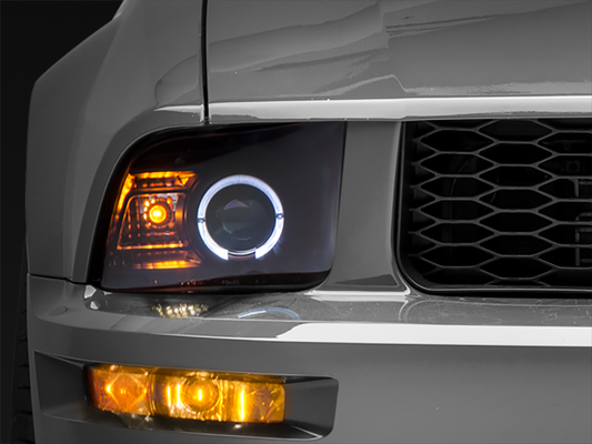 Raxiom 05-09 Ford Mustang Halogen 2010 Style LED Halo Headlights-Blk Hsng(Clear Lens/Excludes GT500)