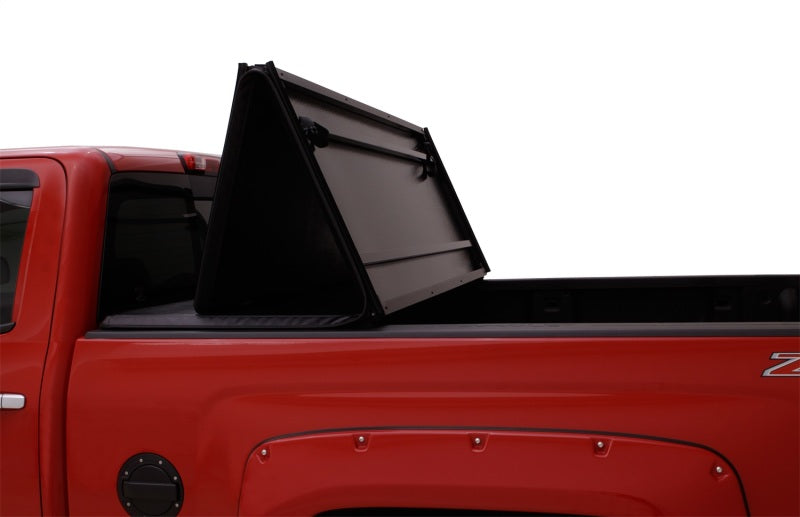 Lund 04-15 Nissan Titan (5.5ft. Bed) Hard Fold Tonneau Cover w/Bracket Kit - Black