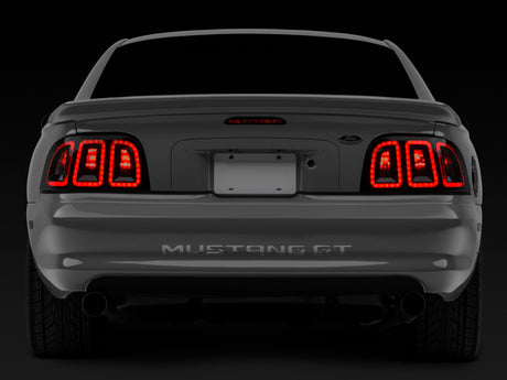 Feux arrière à LED Raxiom 96-98 Ford Mustang Icon - Boîtier noir (lentille fumée)