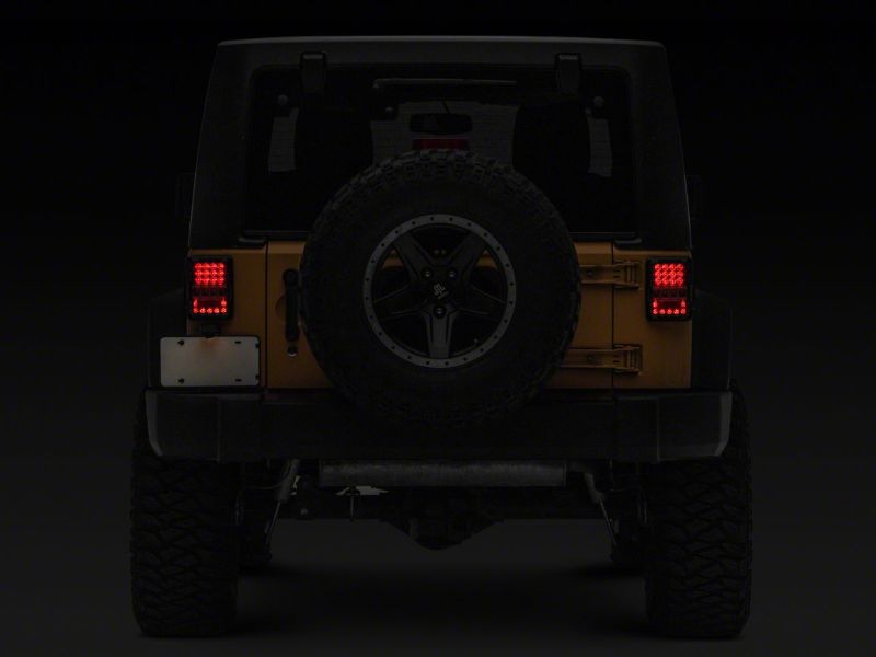 Feux arrière à LED Raxiom 07-18 Jeep Wrangler JK Axial Series Lux - Boîtier noir (lentille transparente)