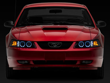 Raxiom 99-04 Ford Mustang Dual LED Halo Projector Headlights- Black Housing (Clear Lens)