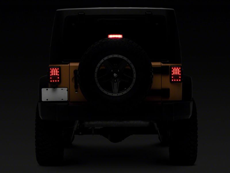 Feux arrière à LED Raxiom 07-18 Jeep Wrangler JK Axial Series - Boîtier noir (lentille transparente)