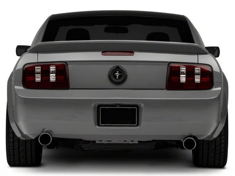 Feux arrière Raxiom 05-09 Ford Mustang Coyote - Boîtier noir (lentille fumée)
