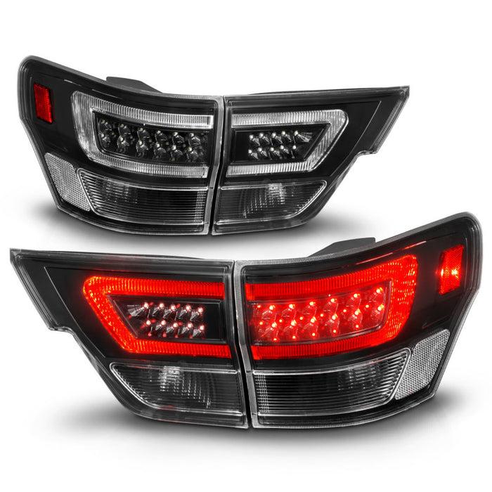 Feux arrière à LED ANZO 11-13 Jeep Grand Cherokee avec barre lumineuse Boîtier noir/lentille transparente 4 pièces