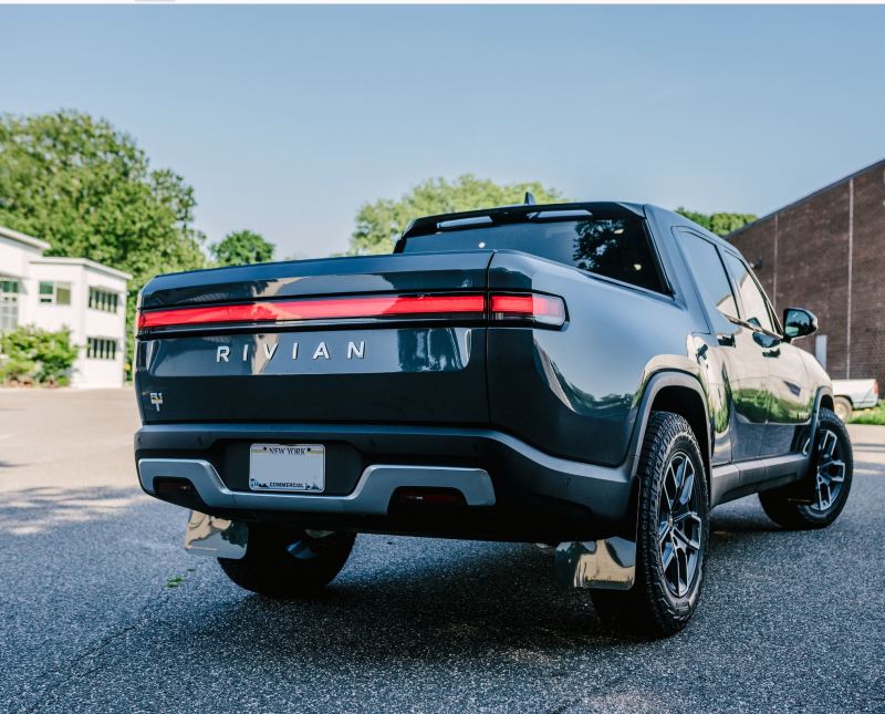 Rally Armor 22-24 Rivian R1T Black UR Mud Flap w/Tangerine Scream Logo