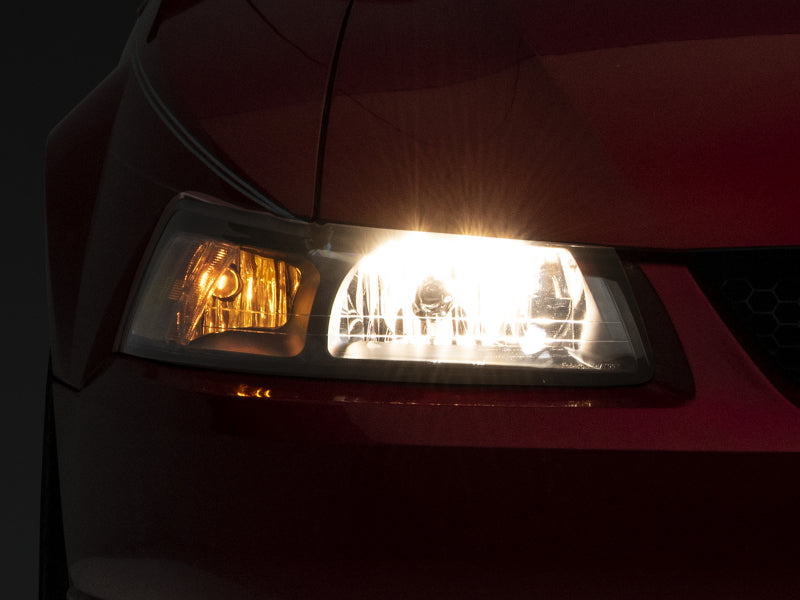 Phares de rechange de style OEM Raxiom Mustang Axial Series 99-04 - Boîtier noir (lentille transparente)