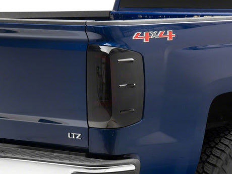 Feux arrière à LED Raxiom 14-18 Chevrolet Silverado 1500 Axial Series - Boîtier noir (lentille fumée)