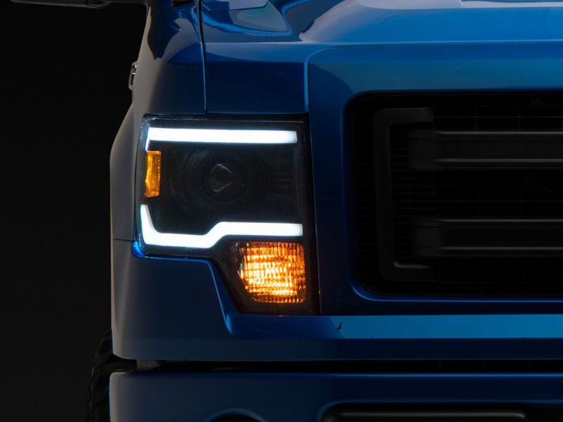 Phares de projecteur Raxiom 09-14 Ford F-150 Axial Series avec barre lumineuse à LED - Boîtier noir (lentille transparente)