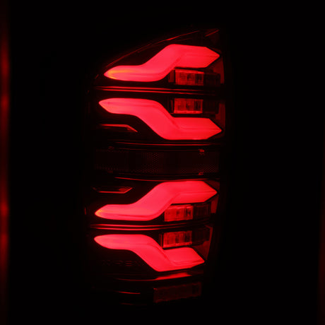 Feux arrière à LED AlphaRex 16-21 Toyota Tacoma LUXX noir/rouge avec lumière active/signal séquentiel