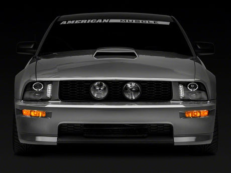 Phares de projecteur à LED Raxiom 05-09 Ford Mustang à l'exclusion de la GT500 - Boîtier noir (lentille transparente)