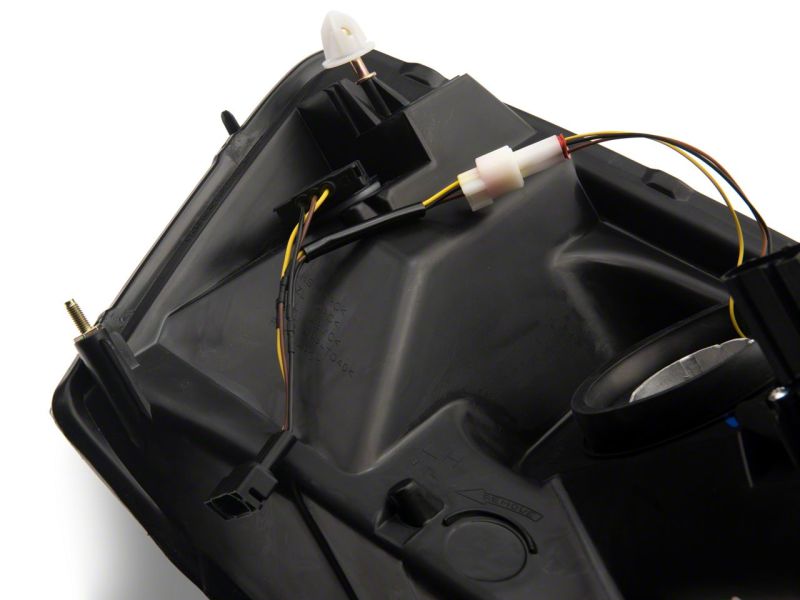 Phares axiaux Raxiom 06-09 Dodge RAM 1500/2500/3500 avec barre LED SEQL - Boîtier noir (lentille transparente)