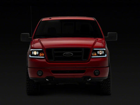 Phares de projecteur Raxiom 04-08 Ford F-150 série axiale avec barre LED SEQL - boîtier noir (lentille transparente)