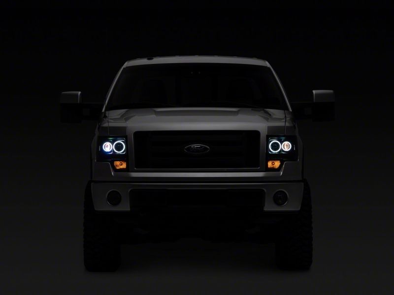 Raxiom 09-14 Ford F-150 Super White LED Halo Projector Headlights- Blk Housing (Clear Lens)