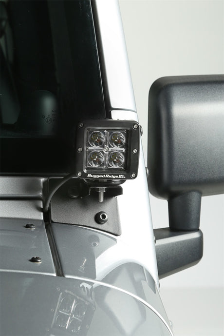 Supports de montage de feux auxiliaires pour pare-brise Rugged Ridge 07-18 Jeep Wrangler JK en noir texturé