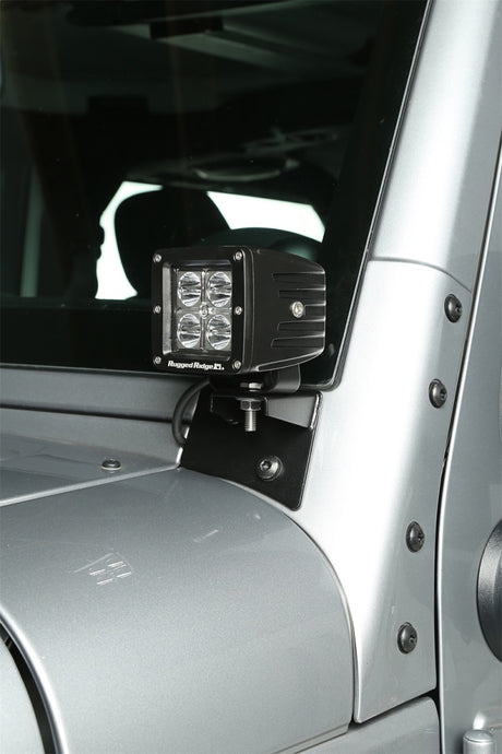 Supports de montage de feux auxiliaires pour pare-brise Rugged Ridge 07-18 Jeep Wrangler JK en noir texturé