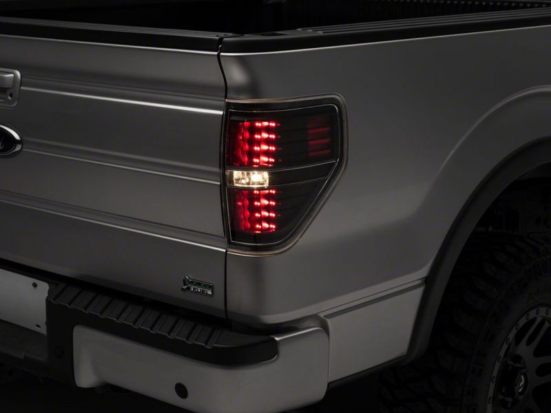 Feux arrière à LED Raxiom 09-14 Ford F-150 Styleside - Boîtier noir (lentille transparente)