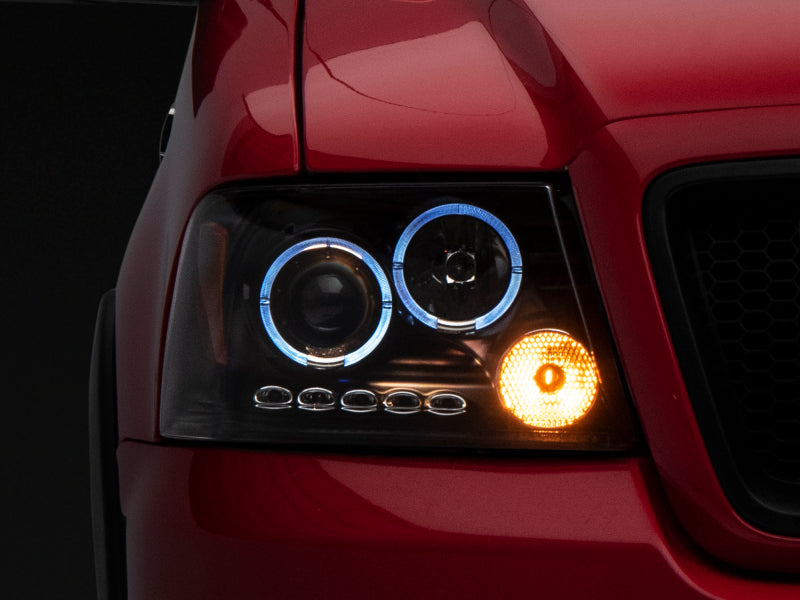 Phares de projecteur à double LED Raxiom 04-08 Ford F-150 - Boîtier noir (lentille transparente)