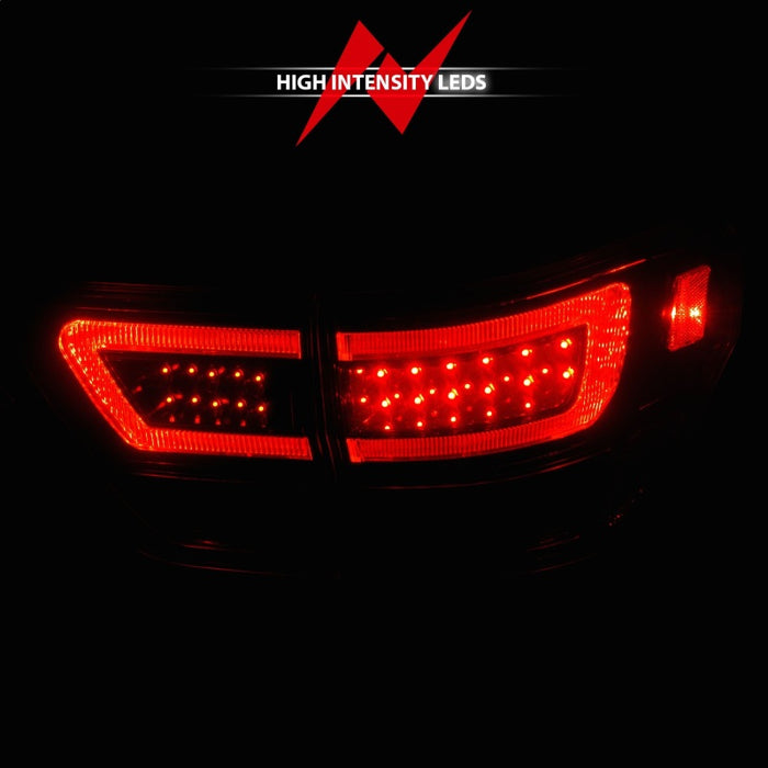 Feux arrière à LED ANZO 11-13 Jeep Grand Cherokee avec barre lumineuse Boîtier noir/lentille transparente 4 pièces