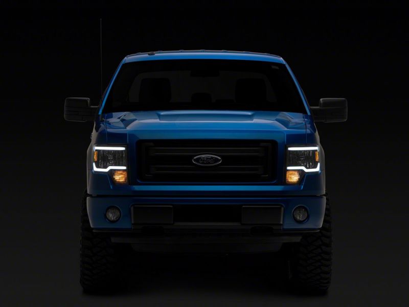 Phares Raxiom 09-14 Ford F-150 série axiale avec barre LED - boîtier noir (lentille transparente)