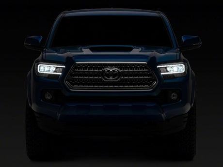 Raxiom 16-23 Toyota Tacoma avec phares halogènes DRL à LED d'usine - Boîtier noir (lentille transparente)