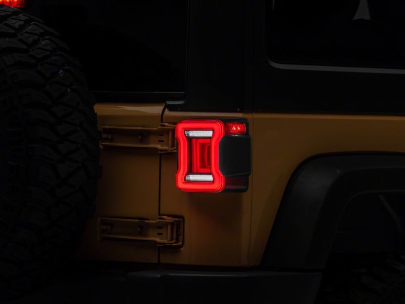 Raxiom 07-18 Jeep Wrangler JK Axial Series JL Style LED Tail Lights- BlkHousing- Red Lens