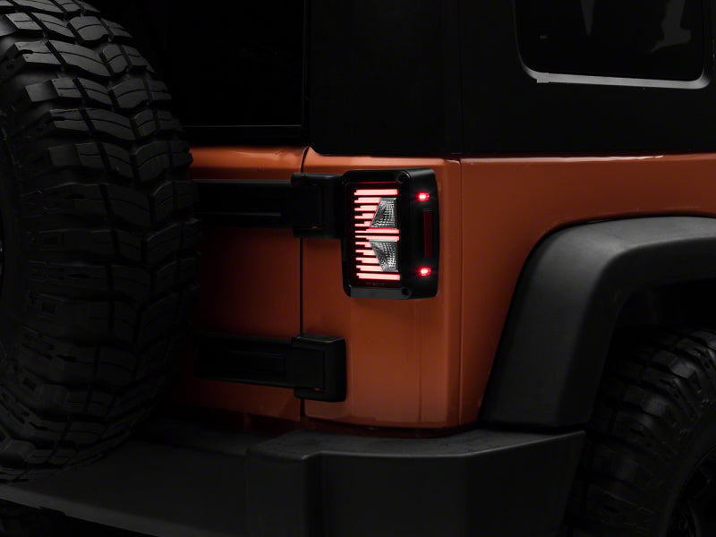 Feux arrière à LED Raxiom 07-18 Jeep Wrangler JK Axial Series Vision - Boîtier noir (lentille transparente)