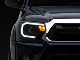 Raxiom 12-15 Toyota Tacoma Axial Series Headlights w/ LED Bar- Blk Housing (Clear Lens)